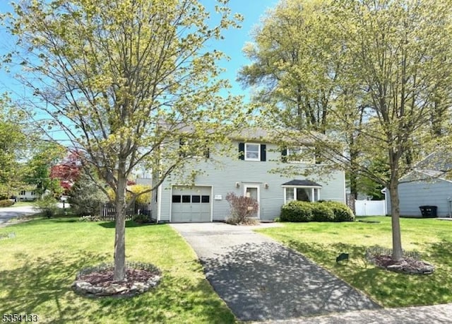 25 Central Ave, Mine Hill Twp, NJ 07803 - colonial-style house featuring fence, driveway, and a front yard