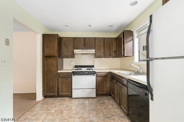 kitchen featuring dark brown cabinetry, a sink, white appliances, light countertops, and under cabinet range hood