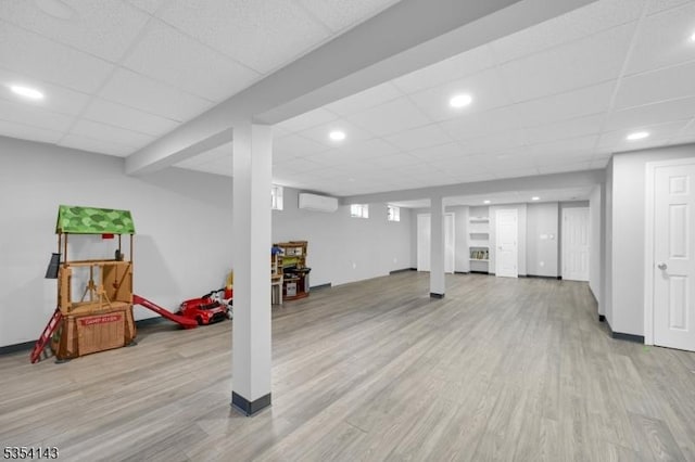 12 Toth Ct, Clifton City, NJ 07014 - finished basement featuring an AC wall unit, recessed lighting, light wood finished floors, and a paneled ceiling
