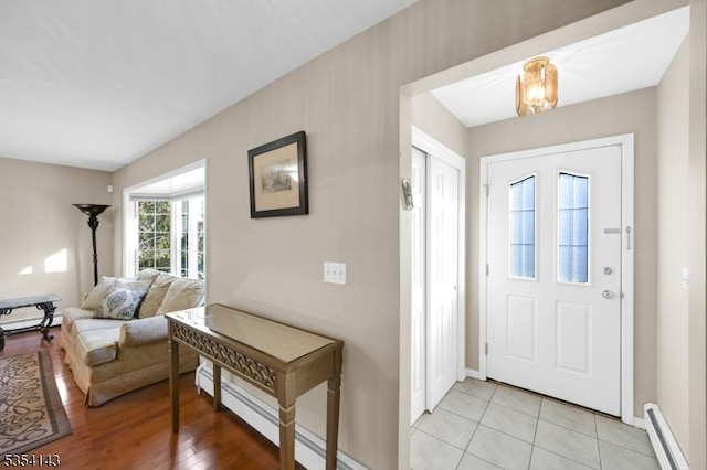 12 Toth Ct, Clifton City, NJ 07014 - foyer entrance with baseboards, a baseboard heating unit, and light tile patterned flooring
