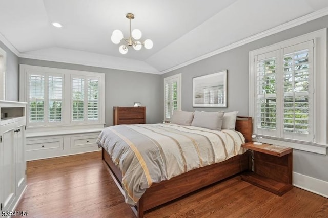 bedroom featuring multiple windows and lofted ceiling