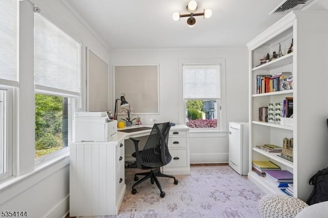 office area featuring visible vents and ornamental molding
