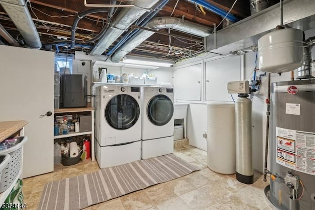 laundry area featuring water heater, laundry area, and independent washer and dryer