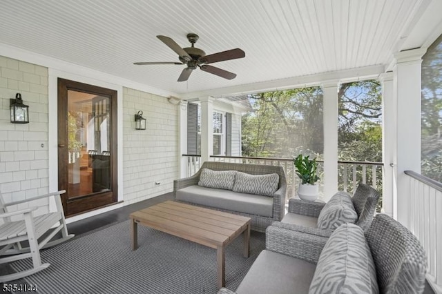 sunroom featuring an outdoor hangout area and a ceiling fan