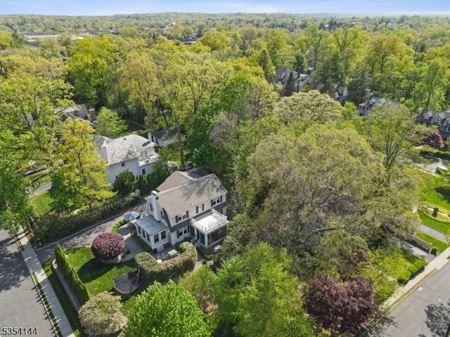 drone / aerial view featuring a view of trees