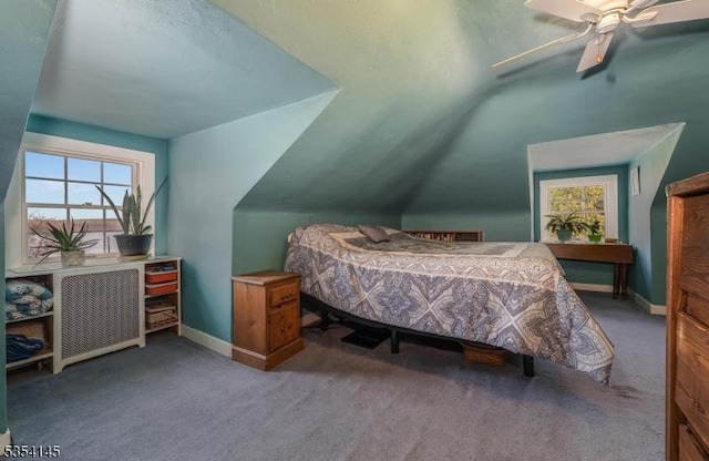 carpeted bedroom with baseboards, ceiling fan, and lofted ceiling