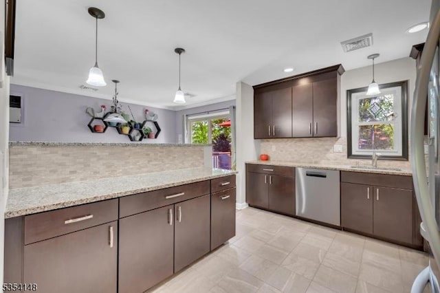 kitchen with stainless steel dishwasher, visible vents, dark brown cabinets, tasteful backsplash, and a sink