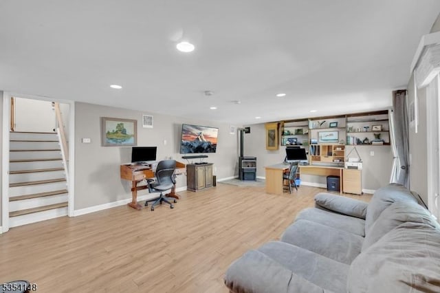 living area featuring recessed lighting, light wood-type flooring, stairs, and visible vents