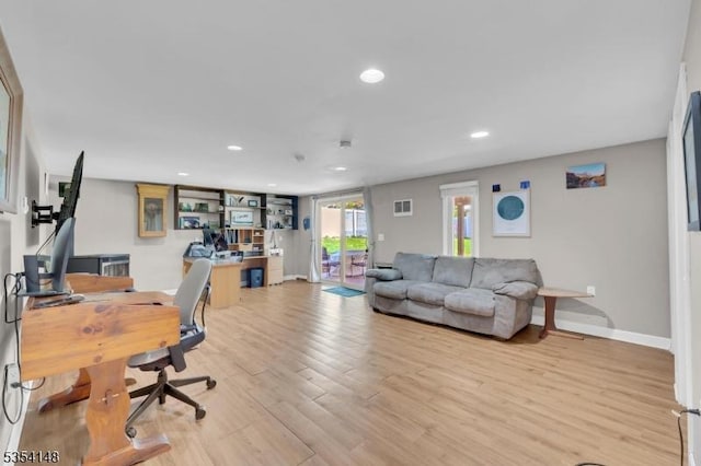 office area with baseboards, light wood-type flooring, and recessed lighting