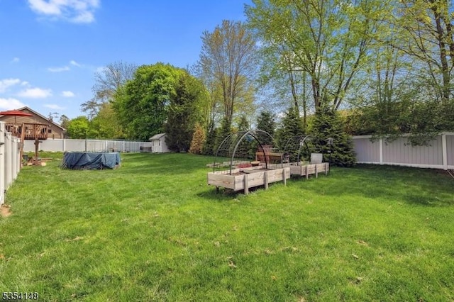 view of yard with a fenced backyard