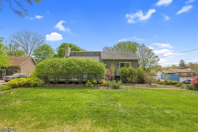 obstructed view of property with a chimney and a front yard