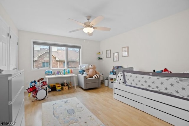 bedroom featuring a ceiling fan and wood finished floors