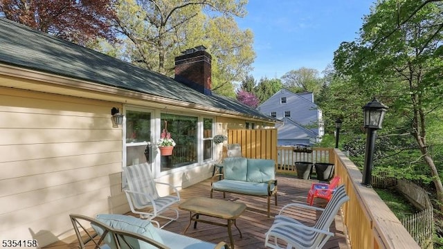 wooden terrace with outdoor lounge area