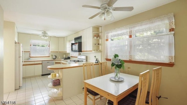 kitchen featuring ceiling fan, open shelves, range, and dishwasher