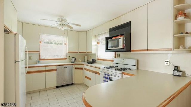 kitchen featuring a ceiling fan, open shelves, light countertops, light tile patterned floors, and white appliances