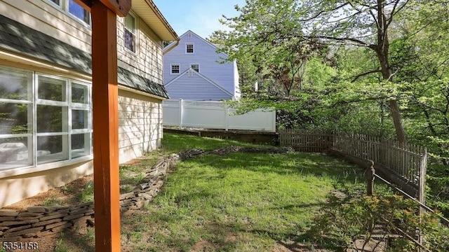 view of yard with a fenced backyard