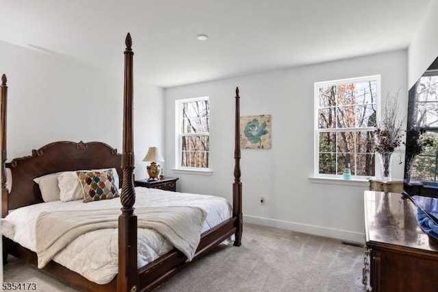 carpeted bedroom with baseboards