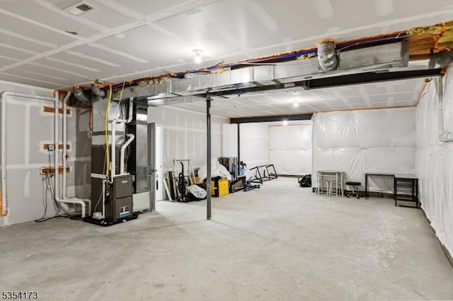 unfinished below grade area with heating unit and visible vents