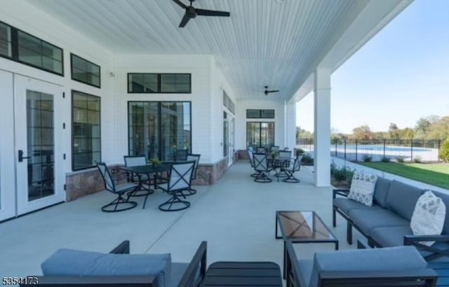 view of patio / terrace with fence, outdoor dining area, outdoor lounge area, and ceiling fan