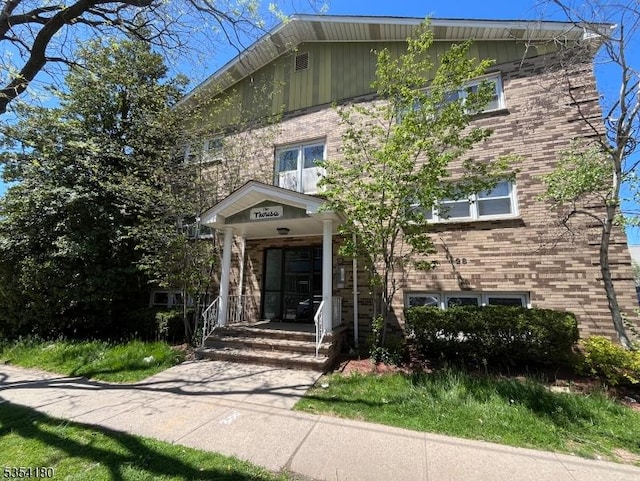 view of front of house featuring brick siding
