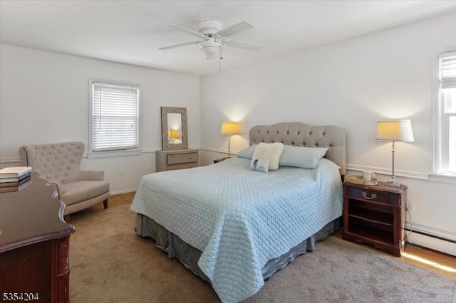 bedroom featuring a baseboard radiator and ceiling fan