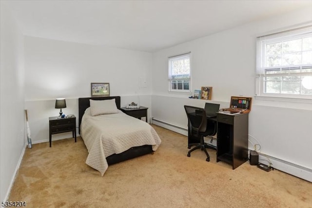 bedroom with carpet floors, a baseboard radiator, and baseboards