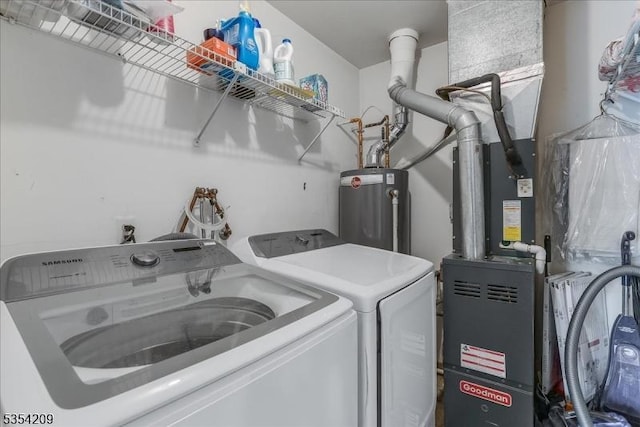 laundry room featuring washer and dryer, laundry area, and water heater