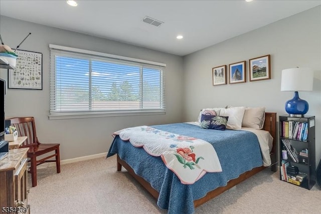 bedroom with visible vents, recessed lighting, baseboards, and light carpet