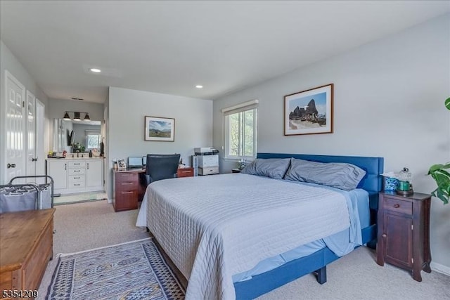 bedroom with light colored carpet and recessed lighting