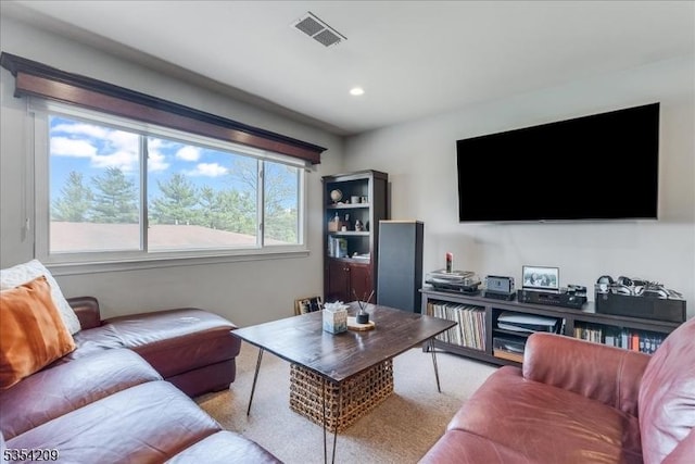 living room featuring visible vents