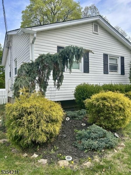 view of property exterior featuring fence