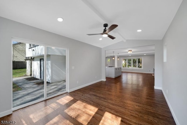 unfurnished living room featuring baseboards, lofted ceiling with beams, a ceiling fan, and dark wood-style floors