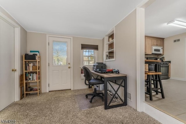 office area with light colored carpet and visible vents