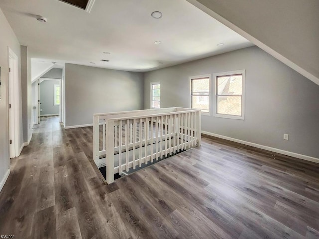 bonus room featuring recessed lighting, baseboards, lofted ceiling, and dark wood-type flooring