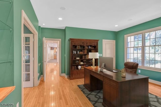 office area with recessed lighting, baseboards, and light wood finished floors