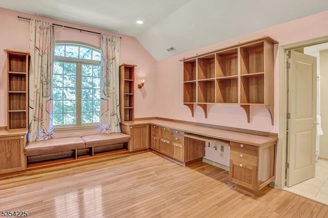 unfurnished office with built in study area, light wood-style floors, recessed lighting, vaulted ceiling, and visible vents