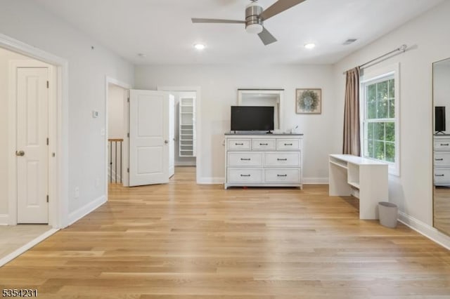 unfurnished bedroom featuring baseboards and light wood-style flooring