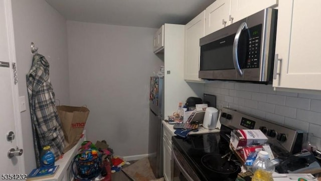 810-814 Leland Ave, Plainfield City, NJ 07062 - kitchen featuring stainless steel appliances, white cabinets, decorative backsplash, and baseboards