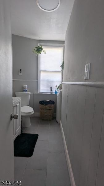 810-814 Leland Ave, Plainfield City, NJ 07062 - half bathroom featuring toilet, tile patterned flooring, and vanity