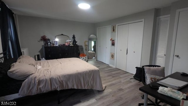 810-814 Leland Ave, Plainfield City, NJ 07062 - bedroom featuring arched walkways, wood finished floors, and multiple closets