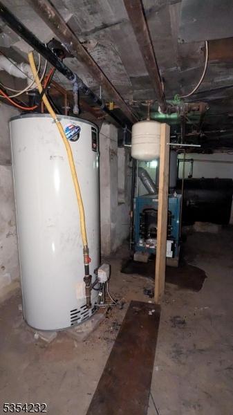 810-814 Leland Ave, Plainfield City, NJ 07062 - unfinished basement featuring gas water heater and a heating unit