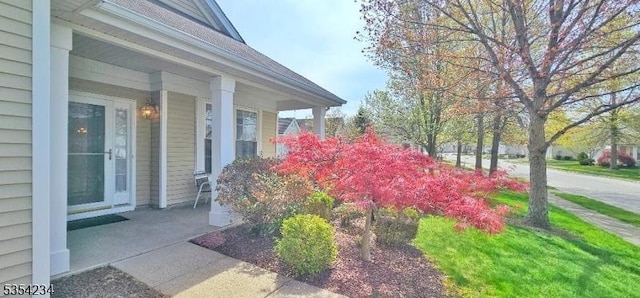 view of property exterior with covered porch