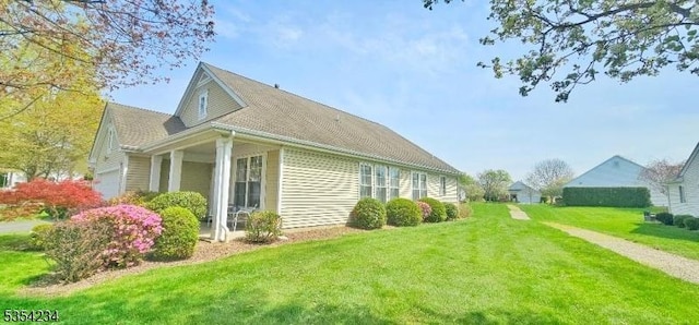 view of side of property featuring a yard