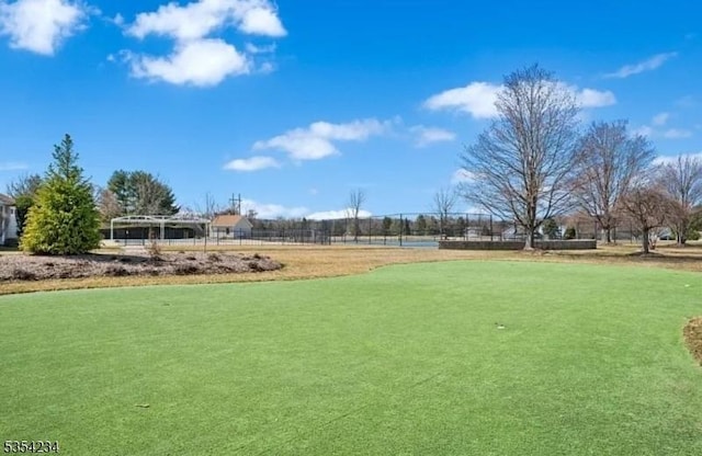 view of property's community with fence
