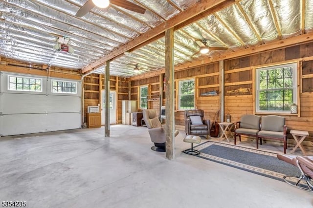garage featuring ceiling fan and a garage door opener