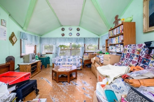 sitting room with lofted ceiling with beams