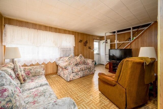 living room with wood walls