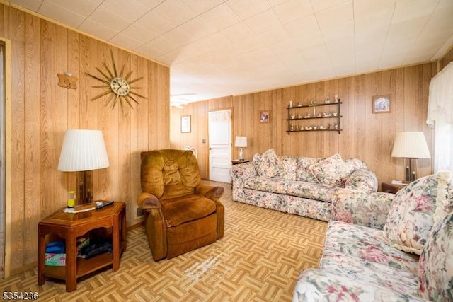living area featuring wood walls
