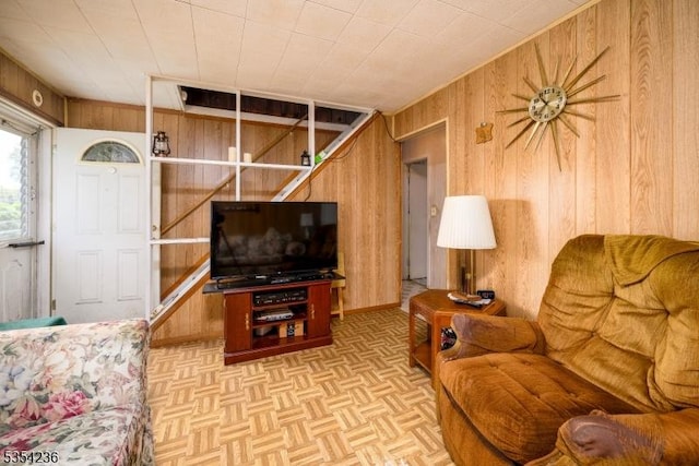 living room featuring wood walls