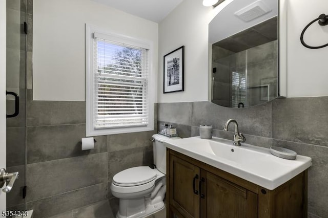 full bathroom with toilet, tile walls, a shower stall, and visible vents